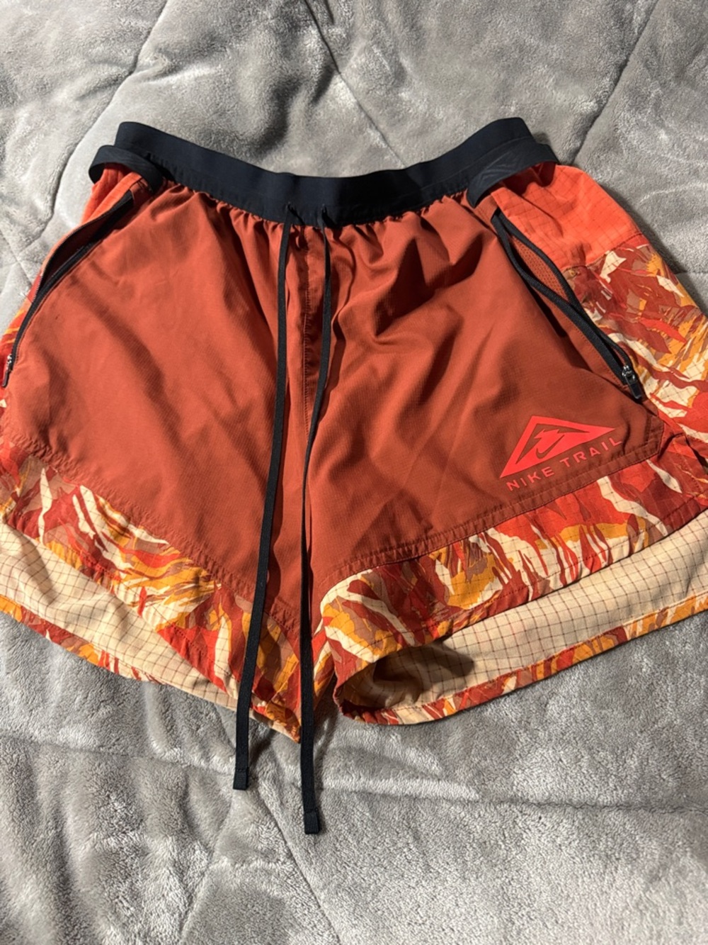 Nike Orange and Black Trail Running Shorts with Patterned Hem